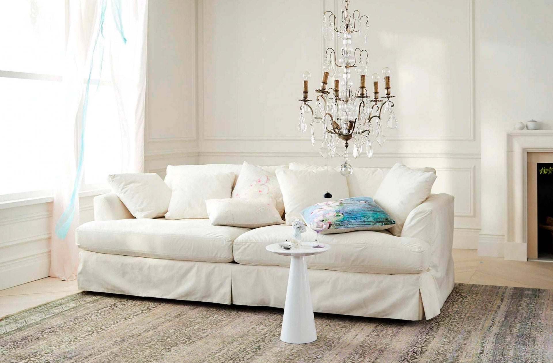 white loft french apartment chandelier white sofa