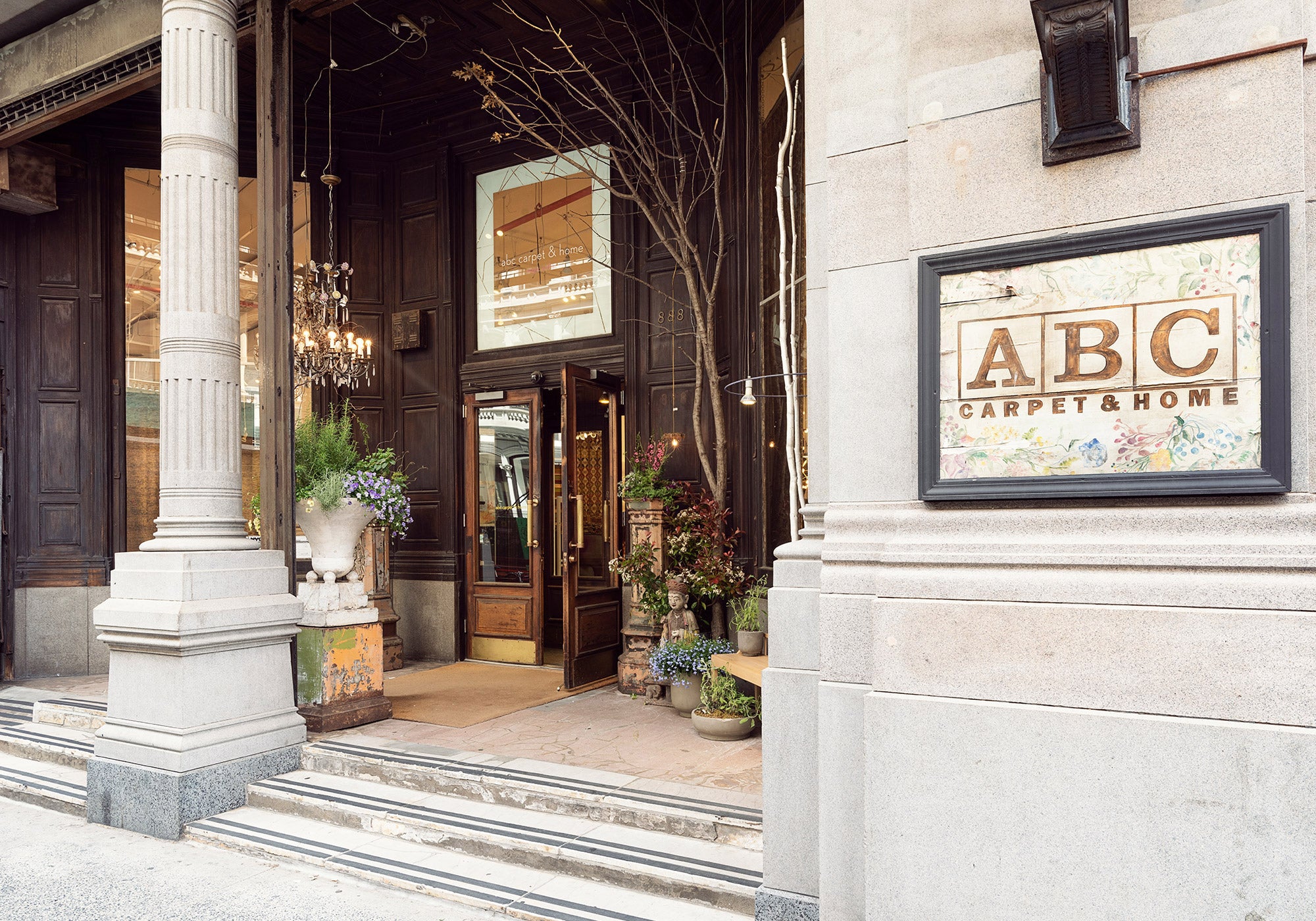 exterior of 888 broadway with abc carpet & home sign, front door, and front steps