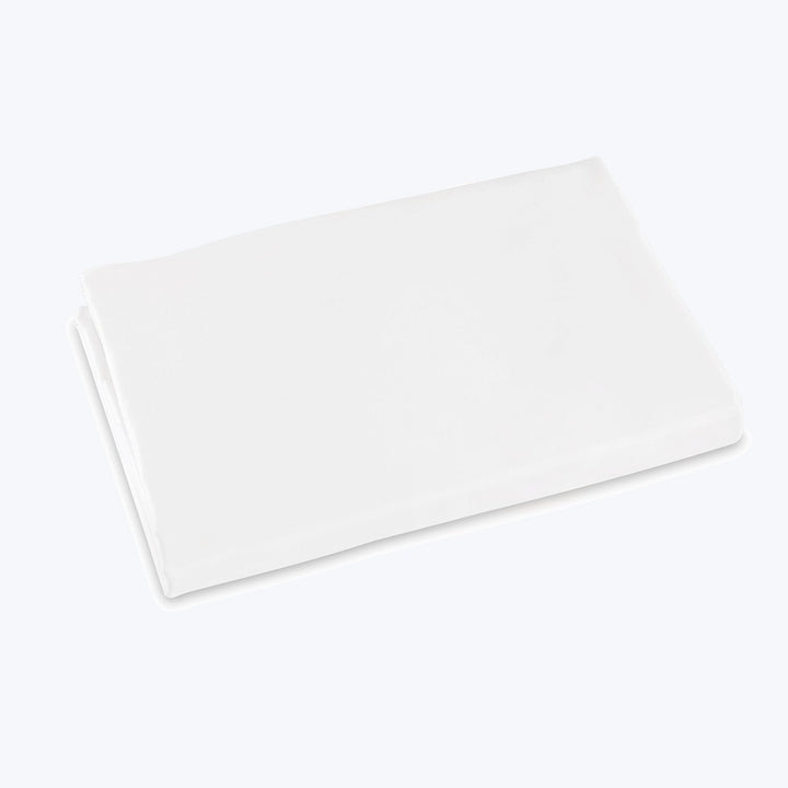 Soft, fluffy white towel against plain white background, minimalist design.