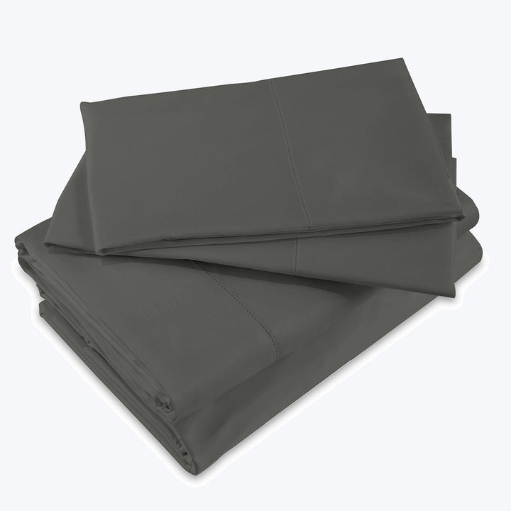 Neatly folded dark gray bed sheets stacked together. Smooth and clean.