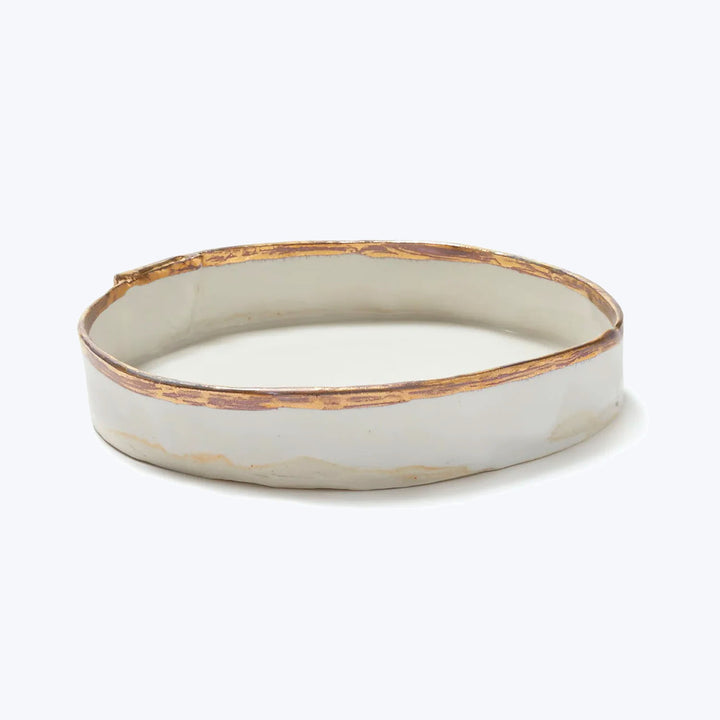 Minimalist oval ceramic tray with white base and brown streaks.