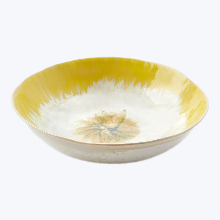 Colorful ceramic bowl with floral motif and gradient design, elegant.