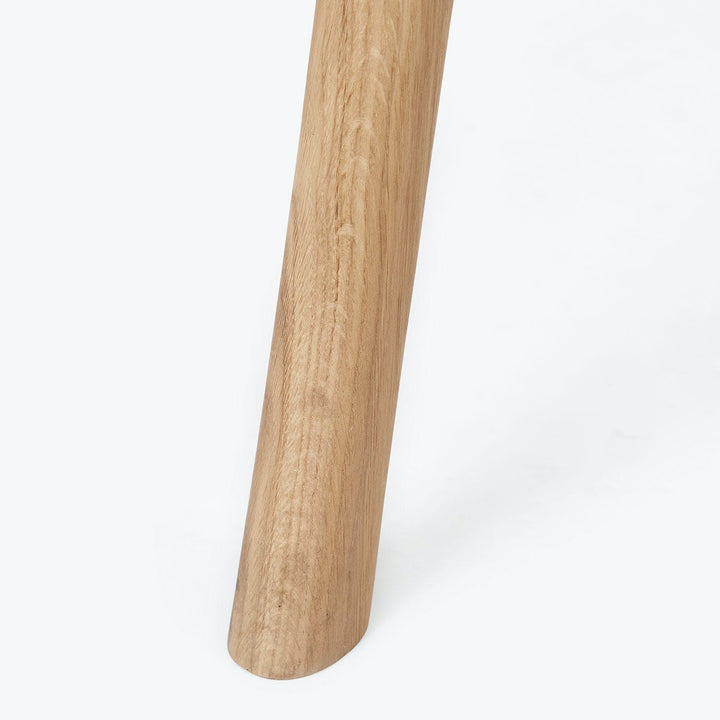 Close-up of a light brown wooden object with natural grain patterns.