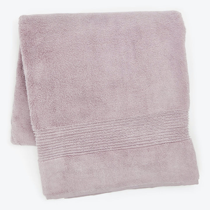 Soft light pink terry cloth bath towel with textured design