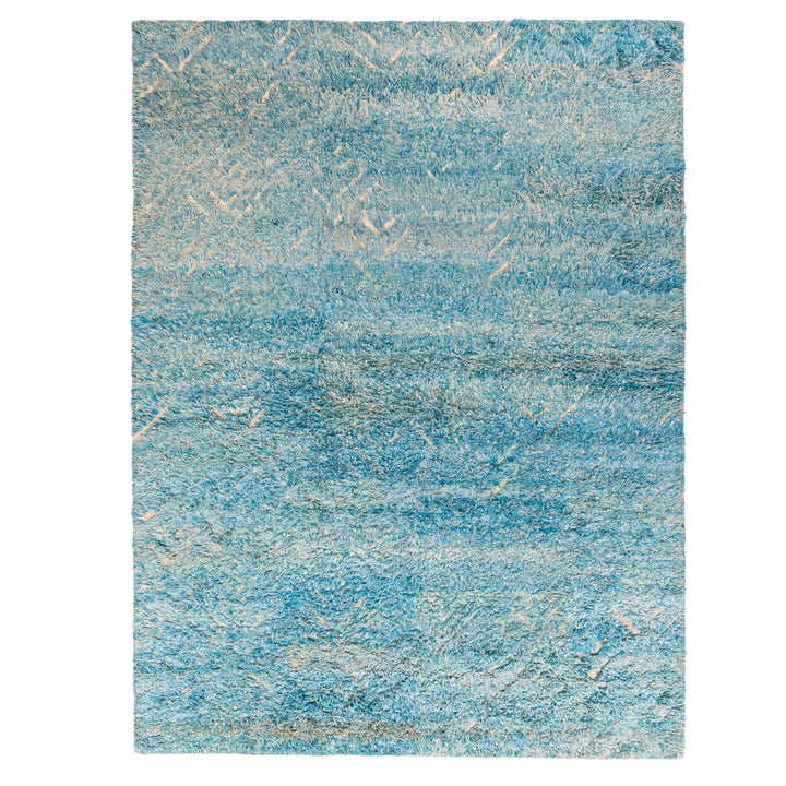 Rectangular rug with gradient blue shades and sporadic light streaks
