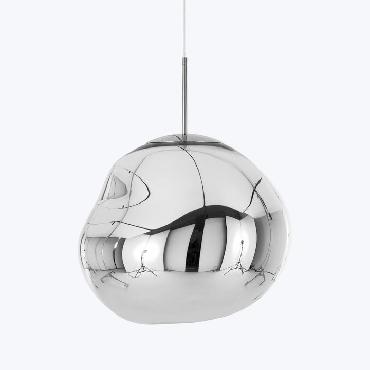 Modern, reflective pendant light with chrome finish and abstract design.