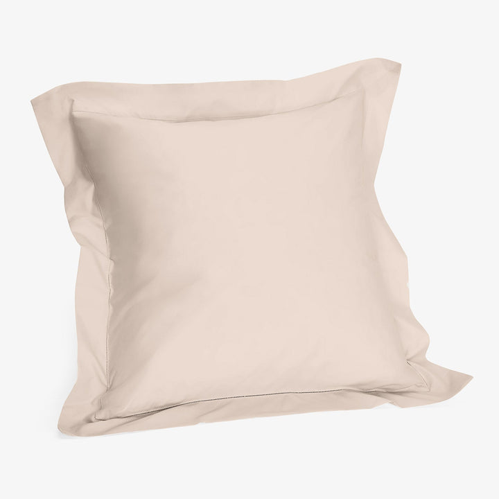 Plain beige pillowcase with smooth, silky fabric against white background.