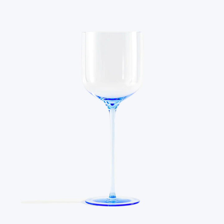 Elegant wine glass with blue accents on white background.