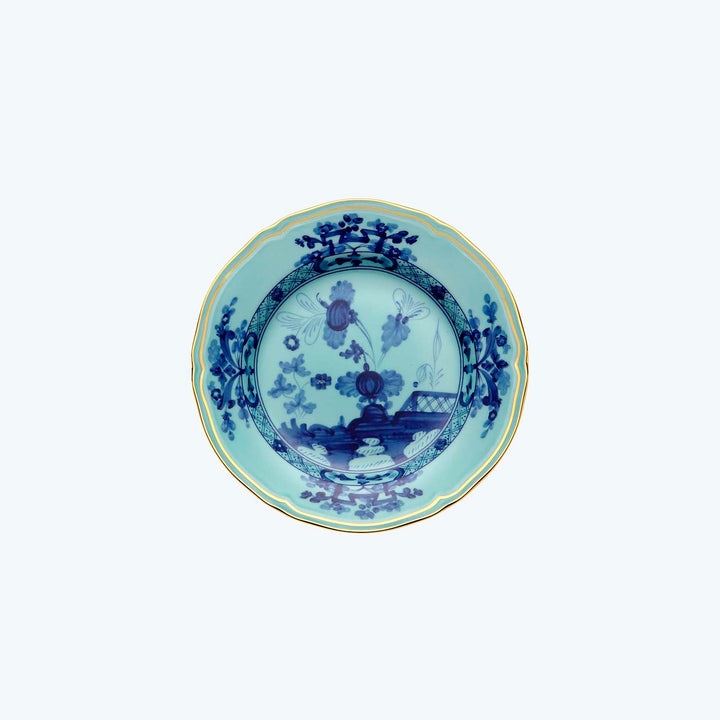 Traditional Chinese porcelain plate with blue and white floral motifs.