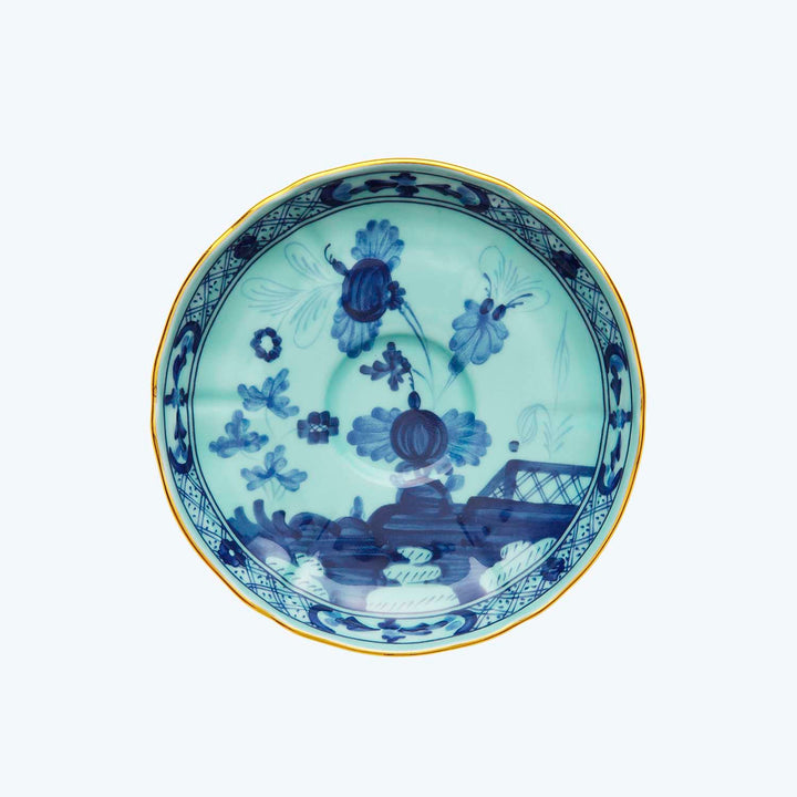 Blue floral ceramic plate with gold accents, traditional East Asian design.
