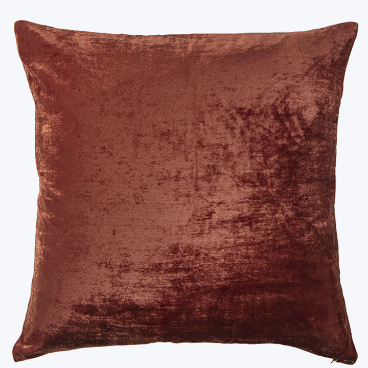 Luxurious square-shaped red velvet pillow with shimmering, plush texture.