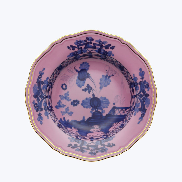 Ornate porcelain plate with fluted edge, two-toned floral design.