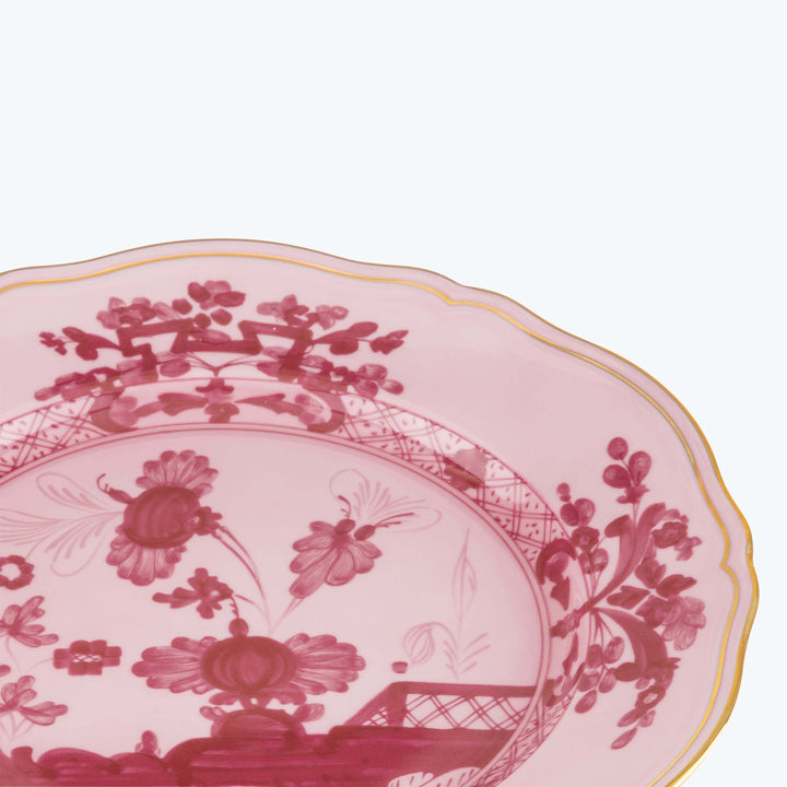 Elegant pink and white floral decorative plate with gold trim.