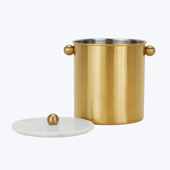Luxurious gold and marble ice bucket with stylish design handles.