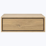 Minimalistic wooden box with single drawer, natural finish, subtle contrast.