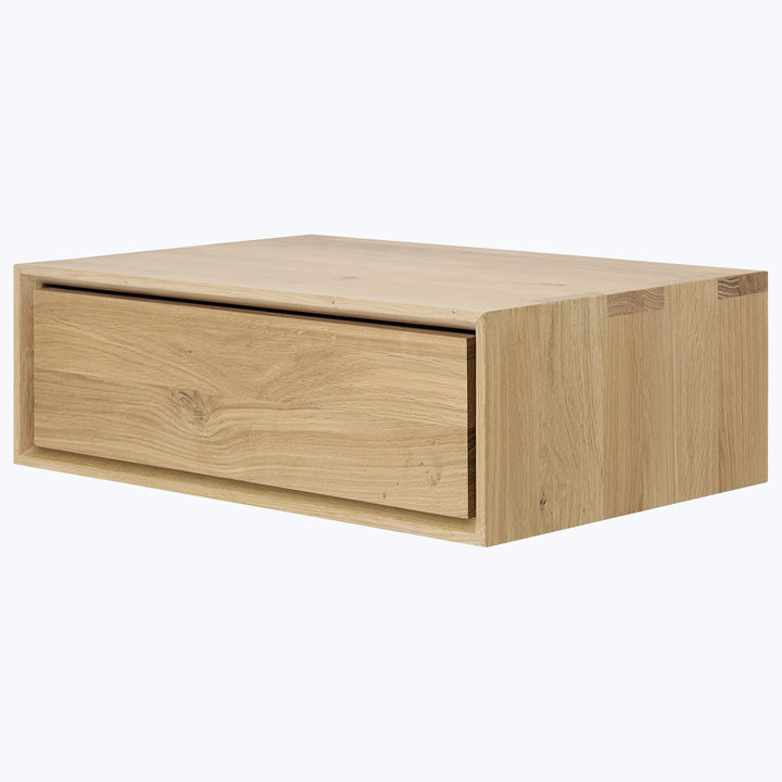 Modern wooden drawer with minimalist design and natural finish texture.