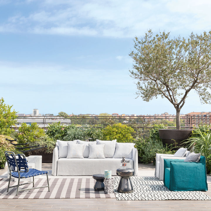 Luxurious outdoor terrace set up for relaxation and entertainment in city.