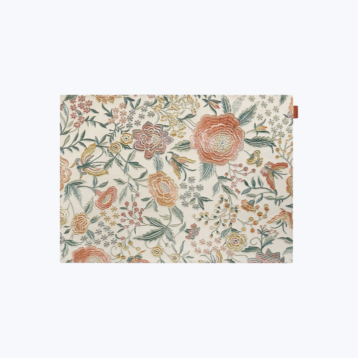 Floral pattern fabric with peach, green, cream, and yellow colors.