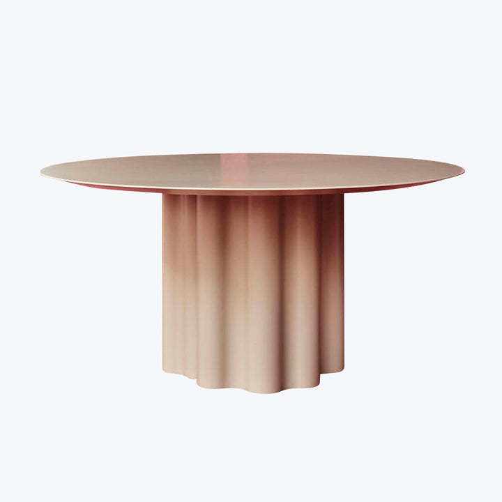 Modern round table with gradient color base and pleated design.
