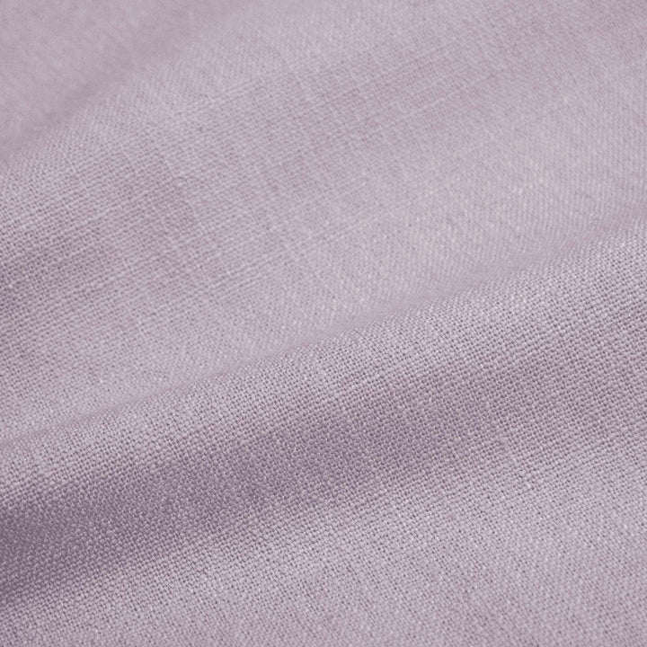 Soft, textured fabric with tight weave in pale hues.