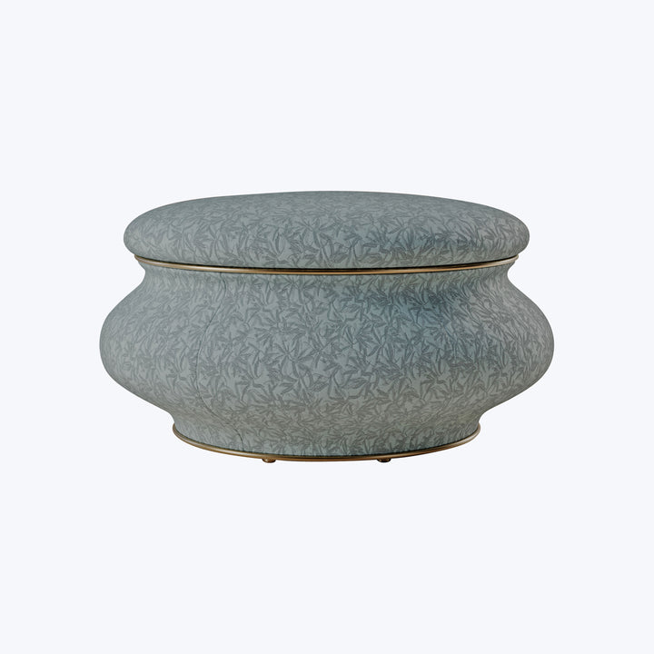 Decorative round pot with leaf pattern in muted blue-green tone.
