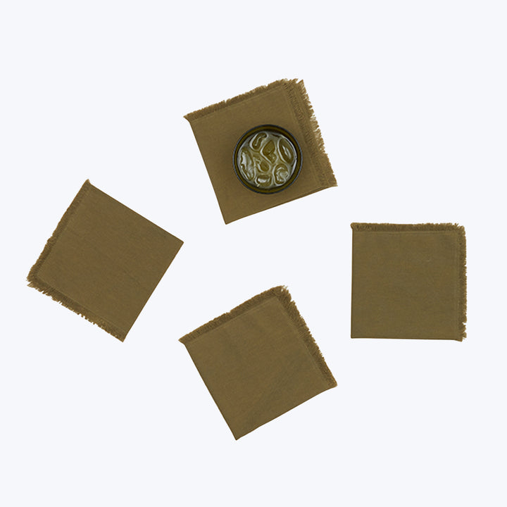 Olive green fabric swatches with frayed edges and intricate seal.