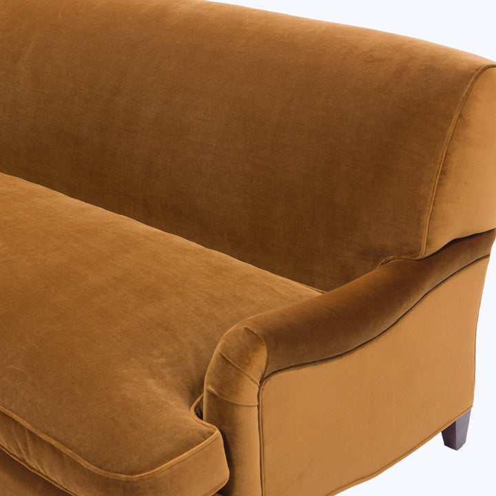 Close-up of luxurious brown velvet sofa with plush cushioning