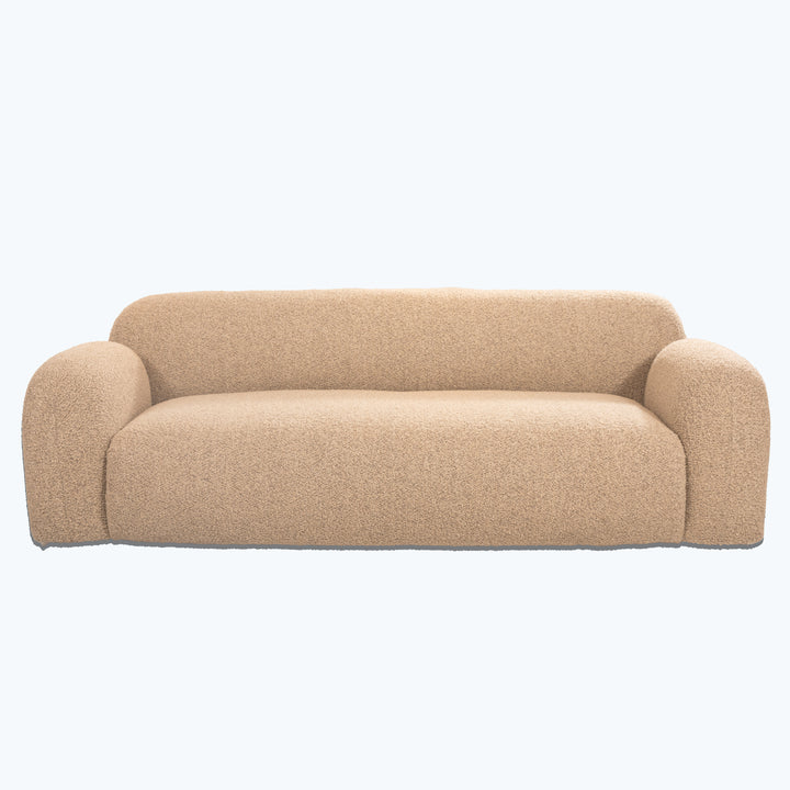 Modern, neutral-toned couch with contoured shape and textured upholstery fabric.