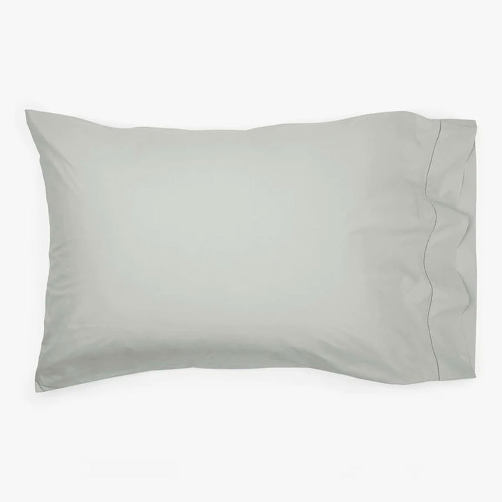 Soft, muted grey or green pillowcase with smooth, comfortable fabric.