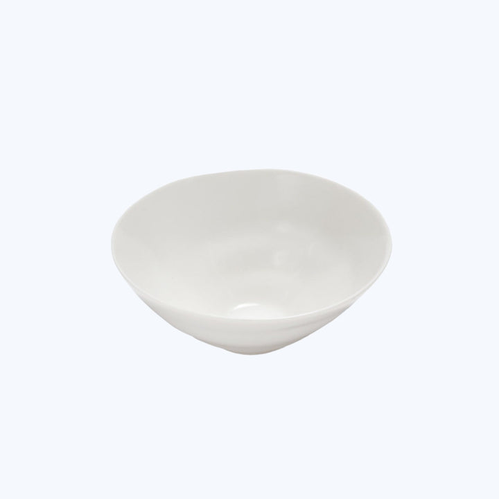 Plain white ceramic bowl with a glossy finish on display.