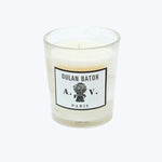 Unburned white candle in glass jar with OULAN BATOR label