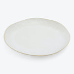 Simple and elegant off-white ceramic plate with a subtle rim.