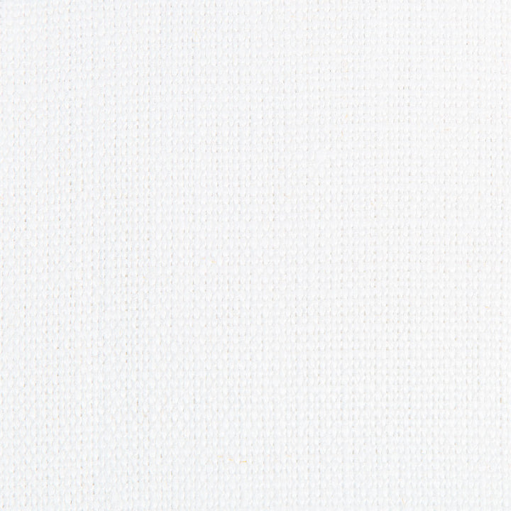 Close-up of white fabric with textured pattern of raised dots.