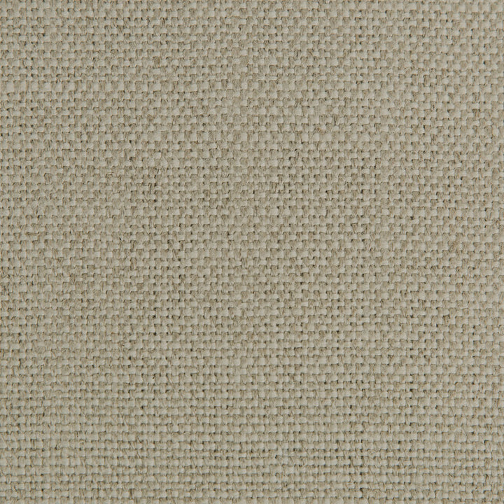Close-up view of a durable, beige fabric with tight weave.