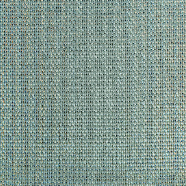 Close-up of green fabric with tight, consistent weave and squares.