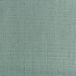 Close-up of green fabric with tight, consistent weave and squares.
