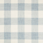Close-up of soft blue and white plaid fabric with herringbone texture.