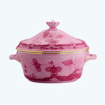 Vibrant pink decorative pot with floral patterns and elegant accents.