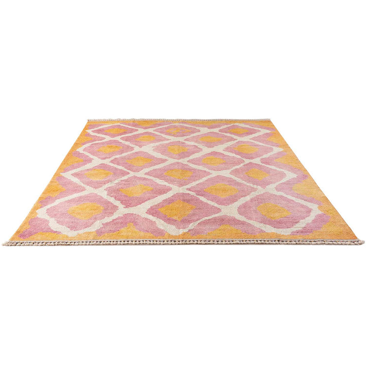 Contemporary geometric rug with warm Moroccan-inspired colors and lattice design.