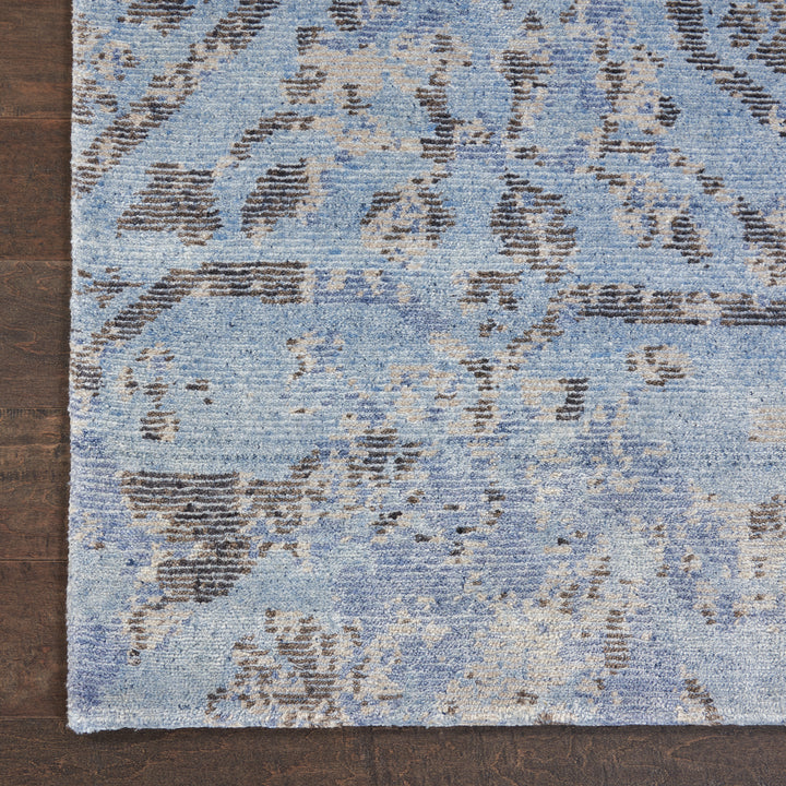 Vintage-style patterned rug on wooden floor creates warm, inviting space.