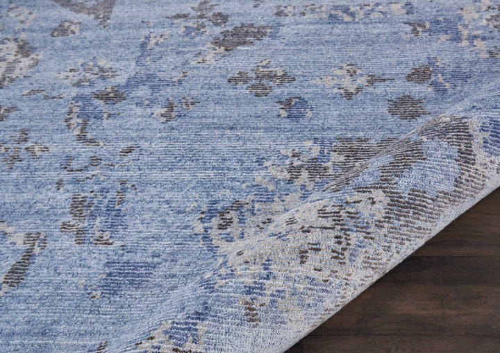 Vintage-inspired distressed area rug adds a touch of elegance.
