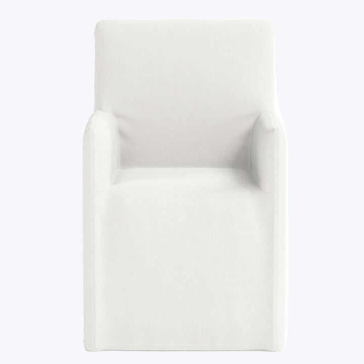 Modern-style armchair in light color against plain background, minimalistic design.