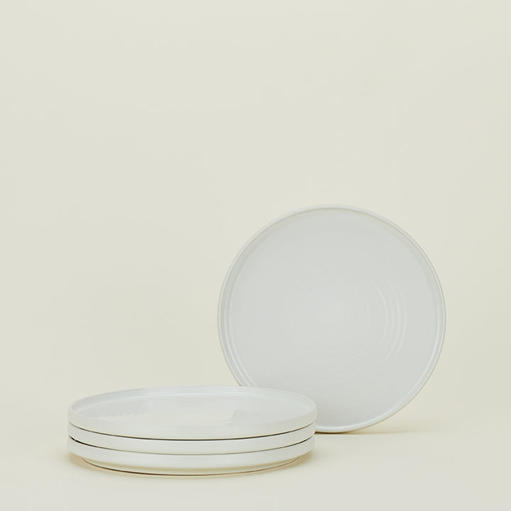 Minimalist white plates showcase simplicity and clean aesthetics.